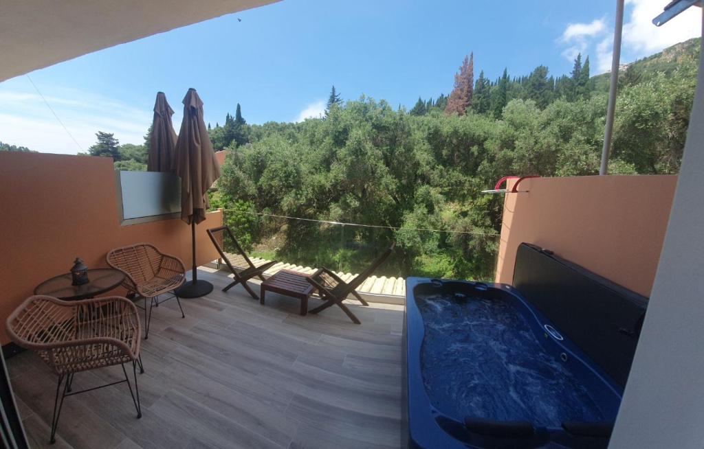 View over the wooded hillside from a terrace at the property